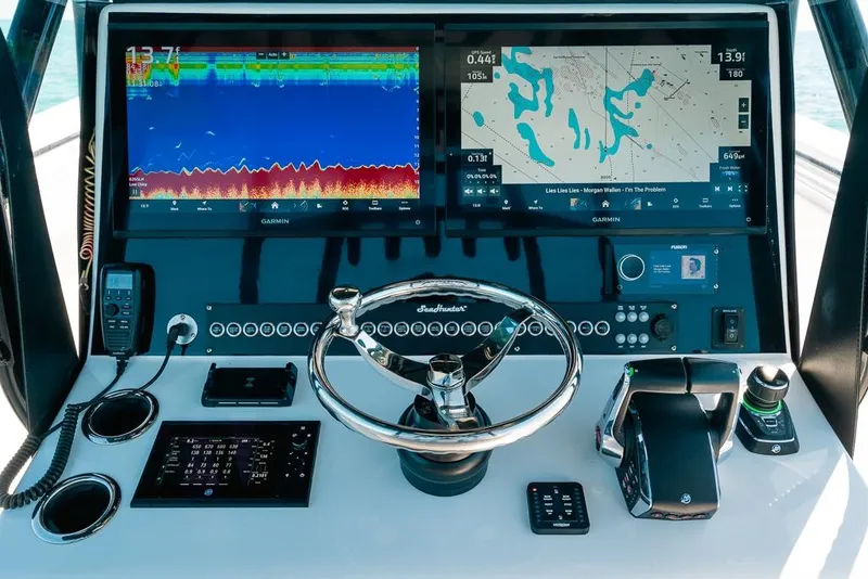 Slide: The Image of 2024 SeaHunter 39 Tournament helm with advanced navigation and control systems. - 29