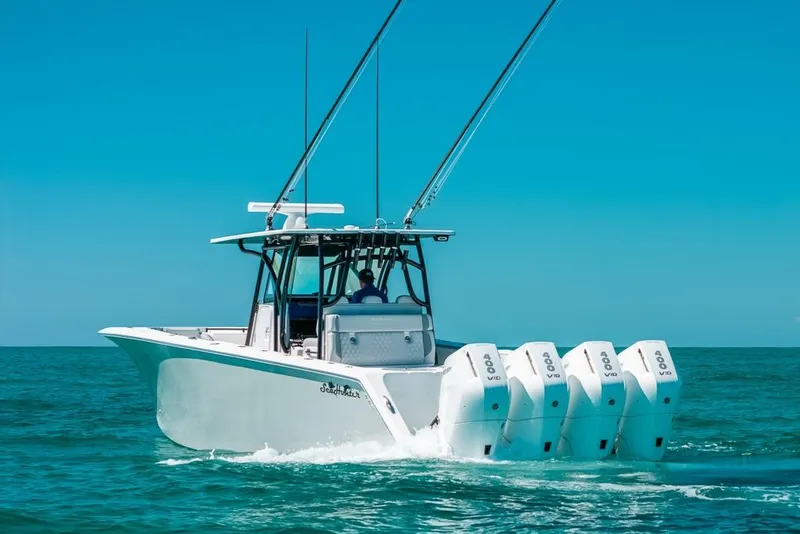 Slide: The Image of 2024 SeaHunter 39 Tournament boat cruising on clear blue ocean waters. - 3