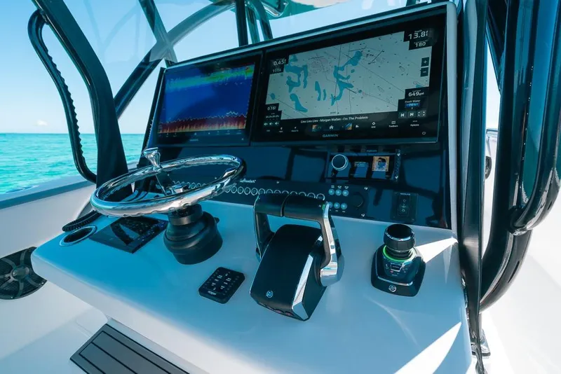 Slide: The Image of 2024 SeaHunter 39 Tournament helm with advanced navigation and control systems on open water. - 30
