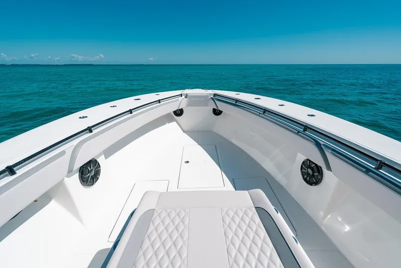 Slide: The Image of 2024 SeaHunter 39 Tournament boat on open ocean, featuring sleek white deck design. - 36
