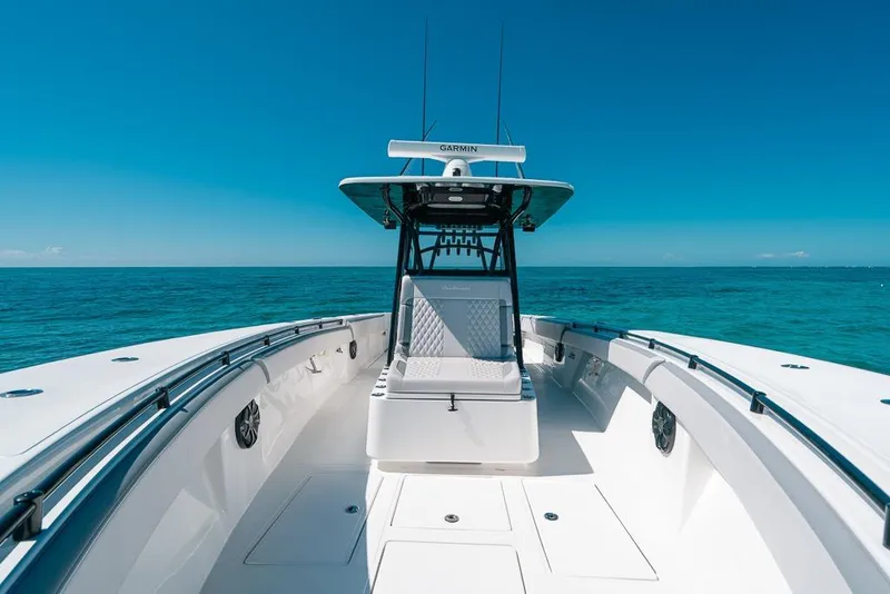 Slide: The Image of 2024 SeaHunter 39 Tournament boat on open ocean, clear blue sky, and calm waters. - 37