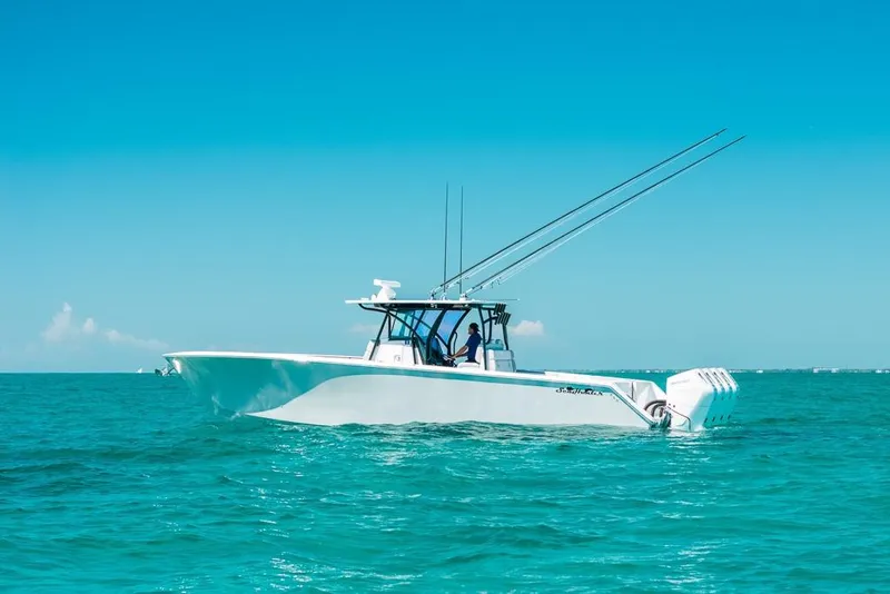 Slide: The Image of 2024 SeaHunter 39 Tournament boat on clear blue ocean waters. - 5