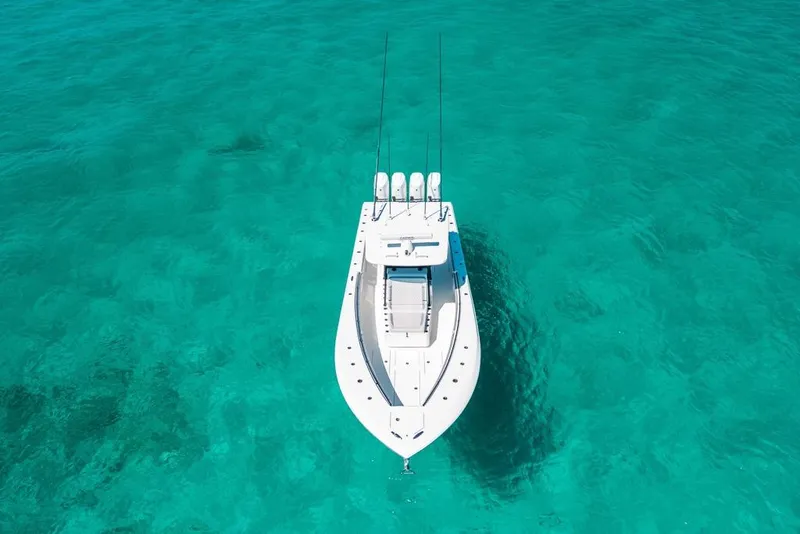 Slide: The Image of 2024 SeaHunter 39 Tournament boat on clear turquoise water, aerial view. - 6