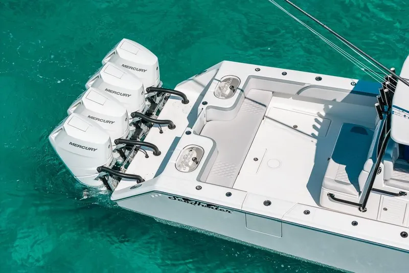 Slide: The Image of 2024 SeaHunter 39 Tournament boat with four Mercury engines on turquoise water. - 7