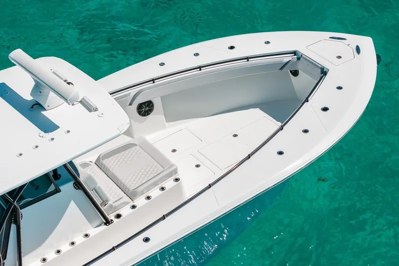 Slide: The Image of 2024 SeaHunter 39 Tournament boat on clear turquoise water, showcasing sleek design and spacious deck. - 8