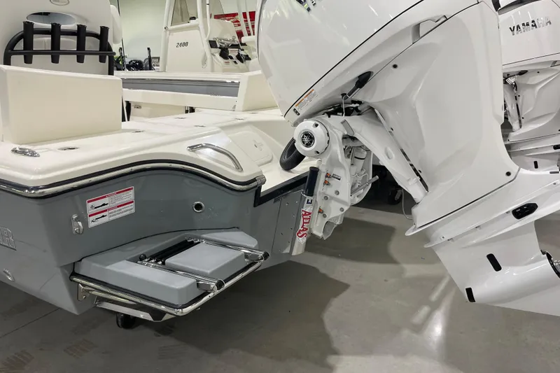 Slide: The Image of 2026 Pathfinder 2500 Hybrid boat with Yamaha outboard motor, featuring a swim platform and ladder. - 7