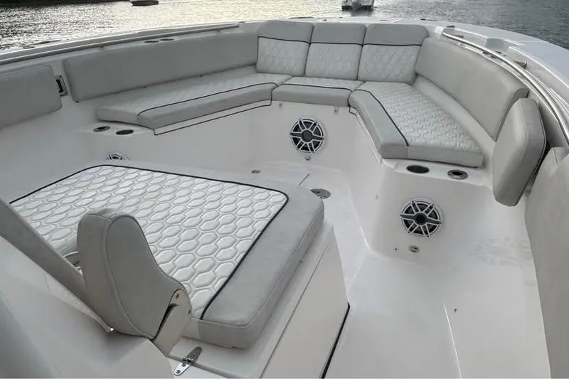 Slide: The Image of Luxurious seating area on 2023 Sea Fox 328 Commander boat, featuring elegant upholstery and speakers. - 12