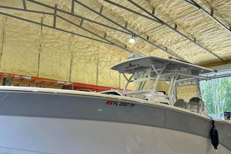 Slide: The Image of 2023 Sea Fox 328 Commander boat in a warehouse, showcasing sleek design and modern features. - 15