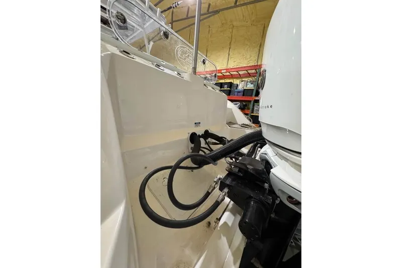Slide: The Image of 2023 Sea Fox 328 Commander boat engine compartment with visible cables and equipment. - 4