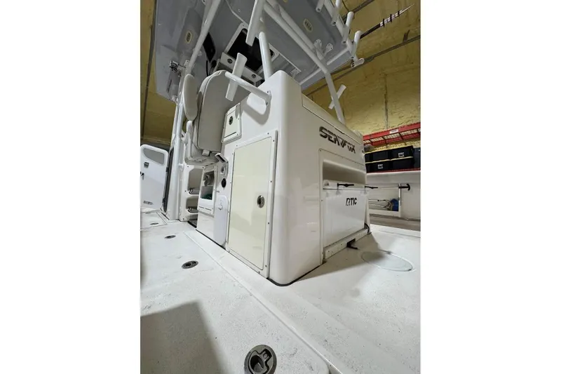 Slide: The Image of 2023 Sea Fox 328 Commander boat interior with storage compartments and seating. - 6