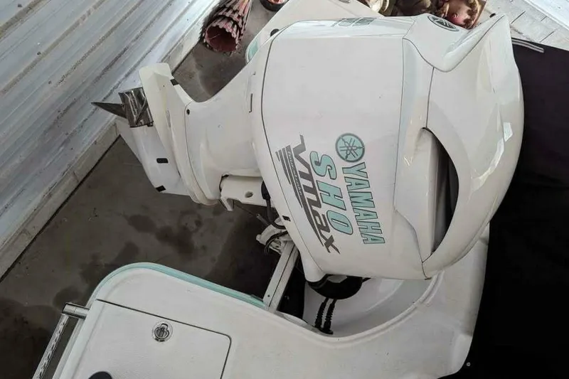 Slide: The Image of 2021 Chaparral 230 Suncoast with Yamaha SHO VMAX outboard motor in a garage setting. - 17