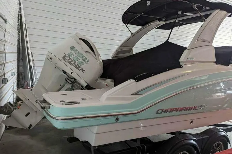 Slide: The Image of 2021 Chaparral 230 Suncoast boat with Yamaha VMAX engine in storage. - 4