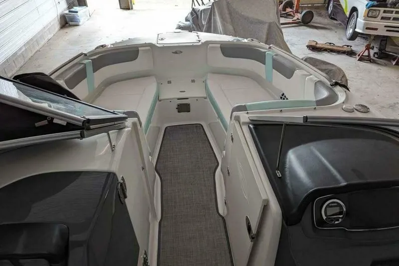 Slide: The Image of 2021 Chaparral 230 Suncoast boat interior with spacious seating and modern design. - 6