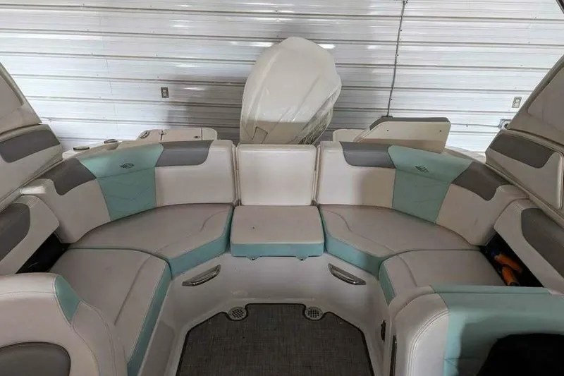 Slide: The Image of 2021 Chaparral 230 Suncoast boat interior with cushioned seating and modern design. - 9