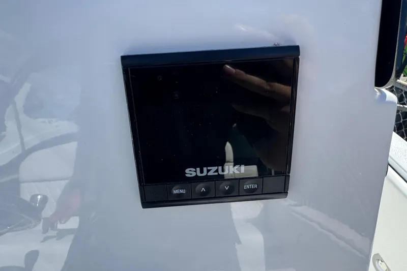 Slide: The Image of Suzuki display panel on 2026 Stingray 173 CC boat dashboard. - 10