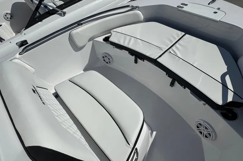 Slide: The Image of 2026 Stingray 173 CC boat interior with white cushioned seating and speakers. - 13