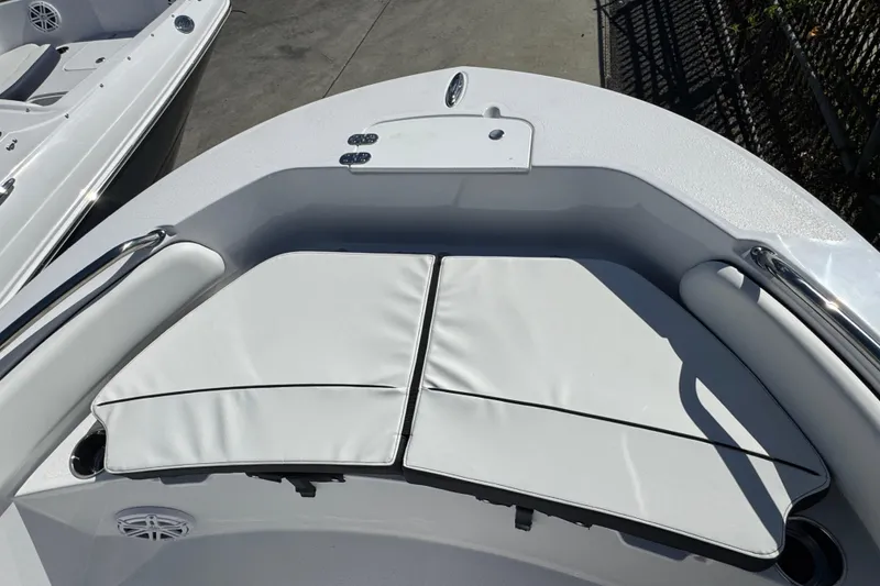 Slide: The Image of 2026 Stingray 173 CC boat bow with cushioned seating and stainless steel railings. - 15