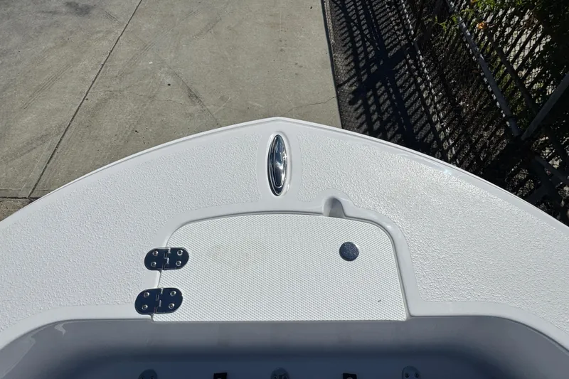 Slide: The Image of Bow of 2026 Stingray 173 CC boat with textured surface and hatch. - 16