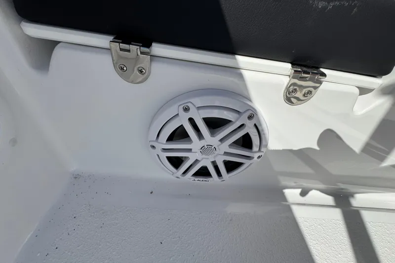 Slide: The Image of 2026 Stingray 173 CC boat interior with speaker and storage compartment. - 24