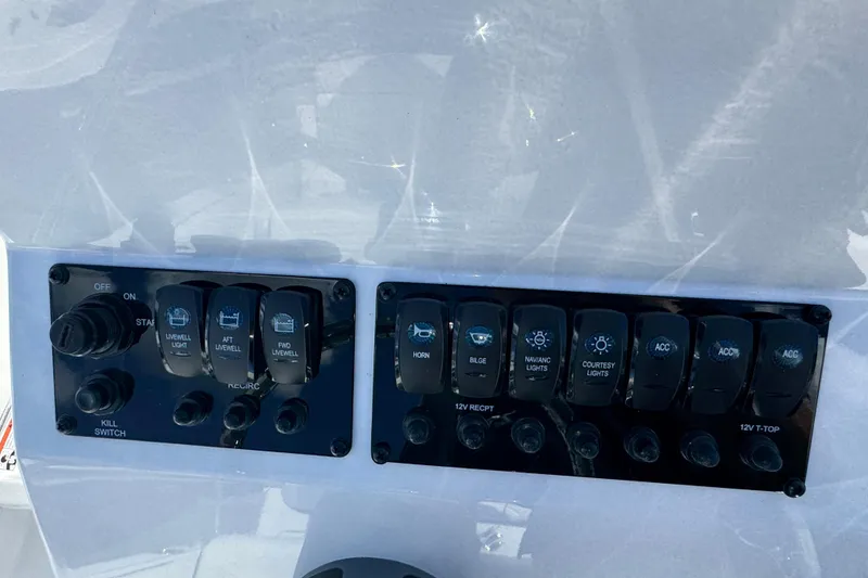 Slide: The Image of Control panel of 2026 Stingray 173 CC boat with various switches and buttons. - 9