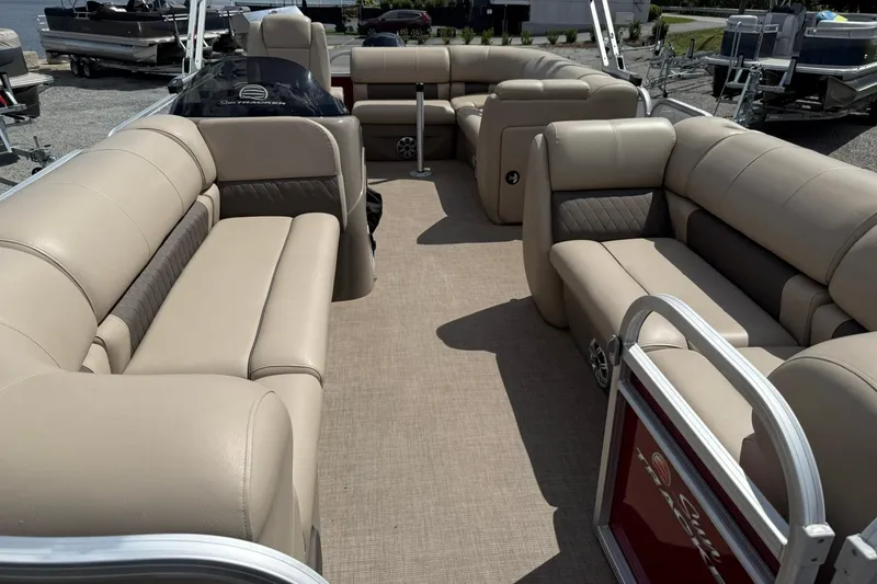 Slide: The Image of 2023 Sun Tracker Party Barge 20 DLX with spacious beige seating and modern design. - 7