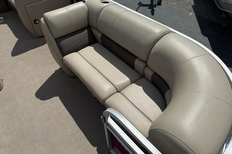 Slide: The Image of 2023 Sun Tracker Party Barge 20 DLX, beige cushioned seating, outdoor setting. - 8