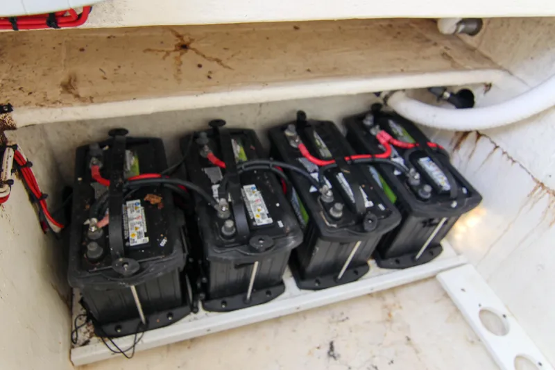 Slide: The Image of Four marine batteries in a 1996 Ocean Master 31 Center Console boat. - 11