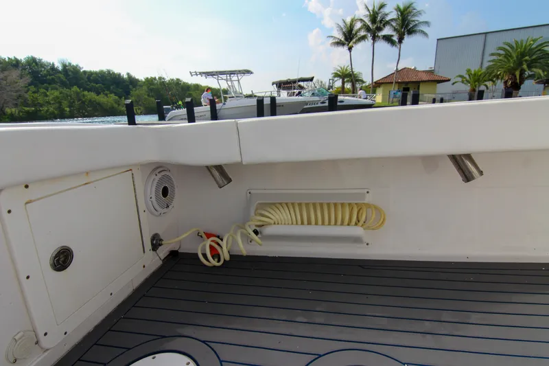 Slide: The Image of Interior view of a 1996 Ocean Master 31 Center Console boat with hose storage. - 18