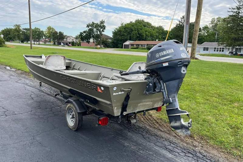 Slide: The Image of 2008 Crestliner CR 1648 boat with Yamaha outboard motor on a trailer. - 5
