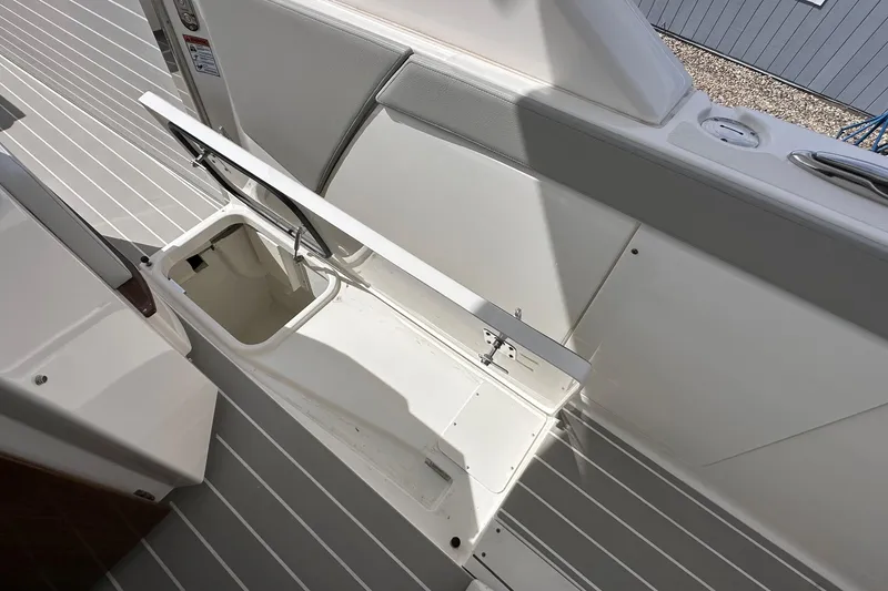 Slide: The Image of Open storage compartment on 2026 Tiara Yachts 48 LS boat deck. - 10