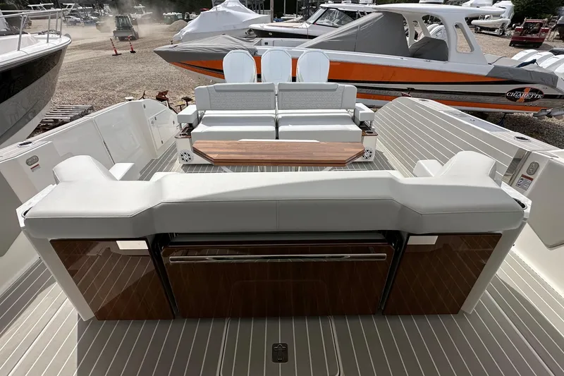 Slide: The Image of 2026 Tiara Yachts 48 LS luxury yacht interior with elegant seating and wooden accents. - 11