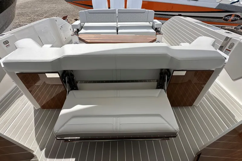 Slide: The Image of 2026 Tiara Yachts 48 LS interior with luxurious seating and wooden accents. - 12