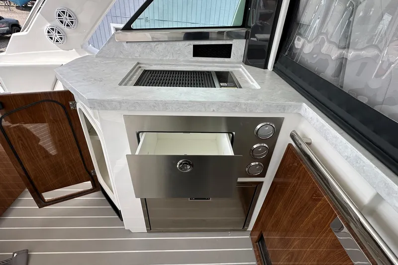 Slide: The Image of Luxury yacht kitchen area with modern appliances on a 2026 Tiara Yachts 48 LS. - 16