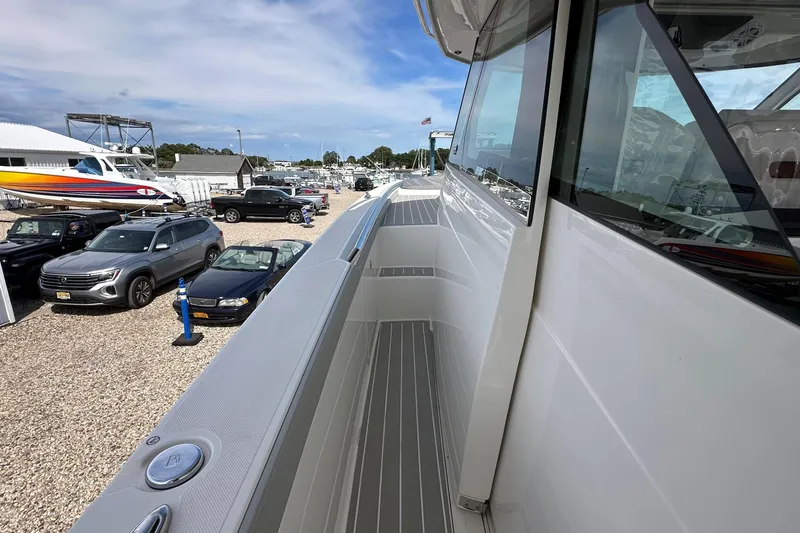 Slide: The Image of 2026 Tiara Yachts 48 LS side view, showcasing sleek design and modern features. - 19