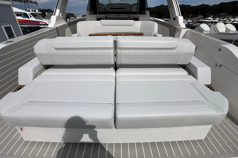 Slide: The Image of 2026 Tiara Yachts 48 LS luxury seating area with white upholstery and elegant design. - 2