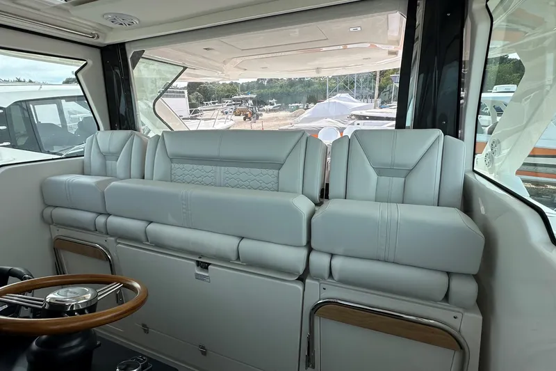 Slide: The Image of Interior of 2026 Tiara Yachts 48 LS, featuring luxurious seating and modern design. - 21