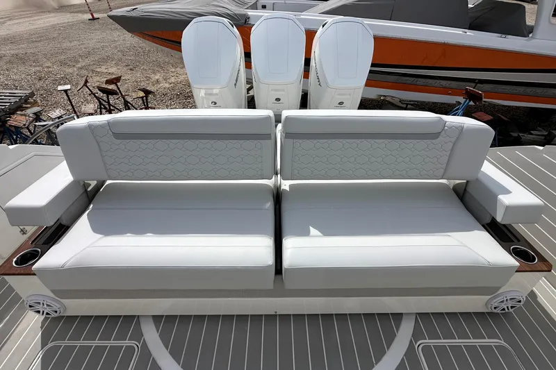 Slide: The Image of Luxury seating on 2026 Tiara Yachts 48 LS, featuring elegant white upholstery and modern design. - 4