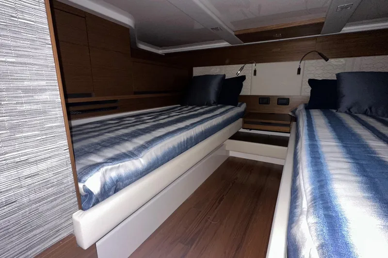 Slide: The Image of Interior of 2026 Tiara Yachts 48 LS with twin beds and modern design. - 40