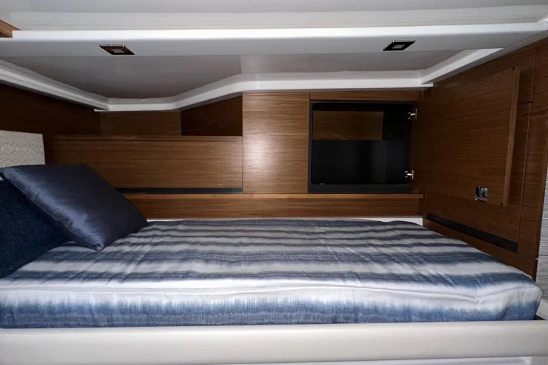 Slide: The Image of Luxurious cabin interior of 2026 Tiara Yachts 48 LS with modern wood finish. - 41