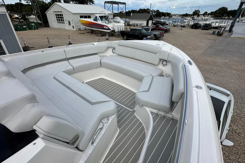 Slide: The Image of Luxurious seating area on 2026 Tiara Yachts 48 LS, docked at a marina. - 45