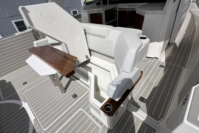 Slide: The Image of Luxurious seating area on 2026 Tiara Yachts 48 LS with elegant wood accents and modern design. - 8