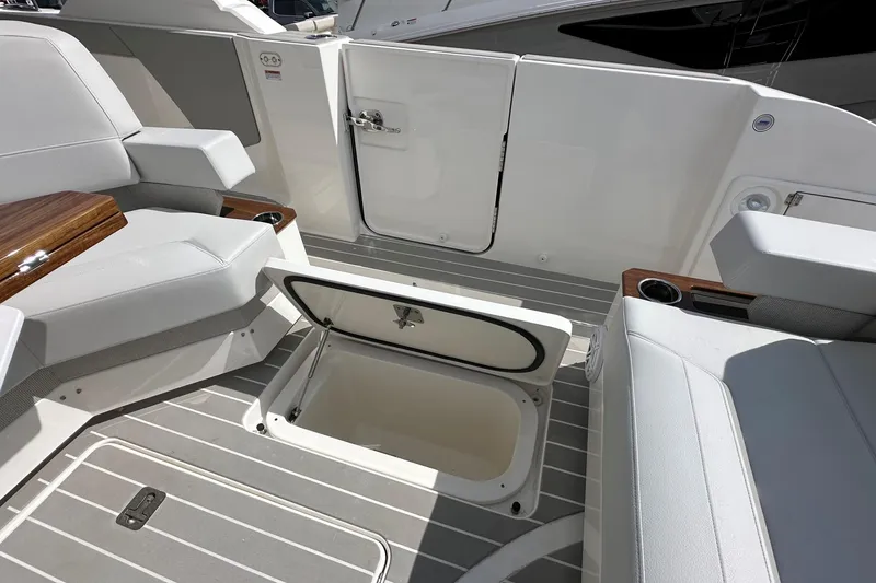 Slide: The Image of 2026 Tiara Yachts 48 LS interior with open storage compartment and seating area. - 9