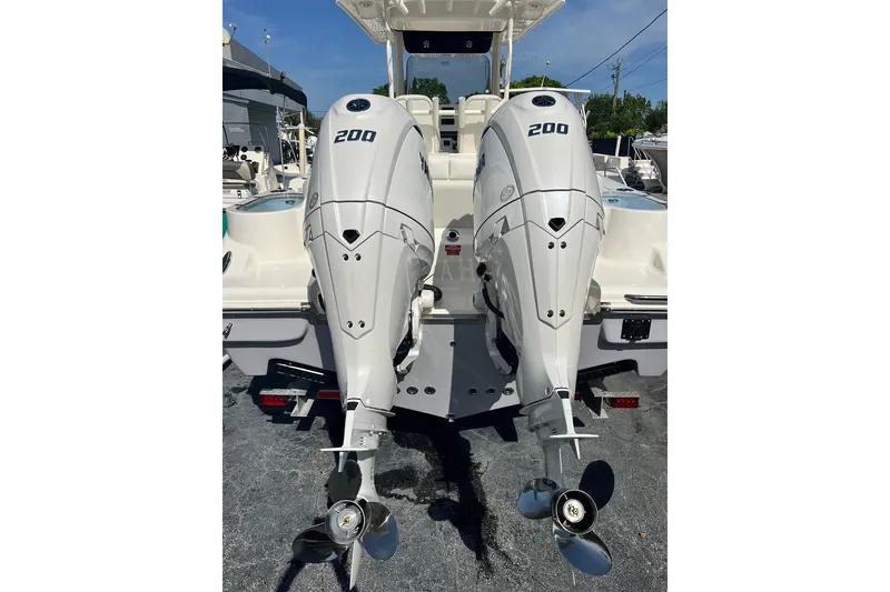 Slide: The Image of Twin 200 horsepower outboard engines on a 2026 Key West 263 FS boat. - 14