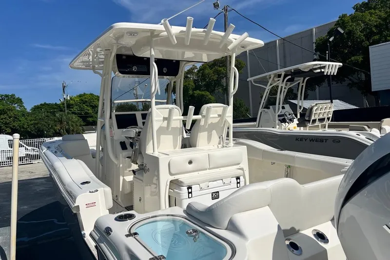 Slide: The Image of 2026 Key West 263 FS boat with sleek design and modern features, docked outdoors. - 15