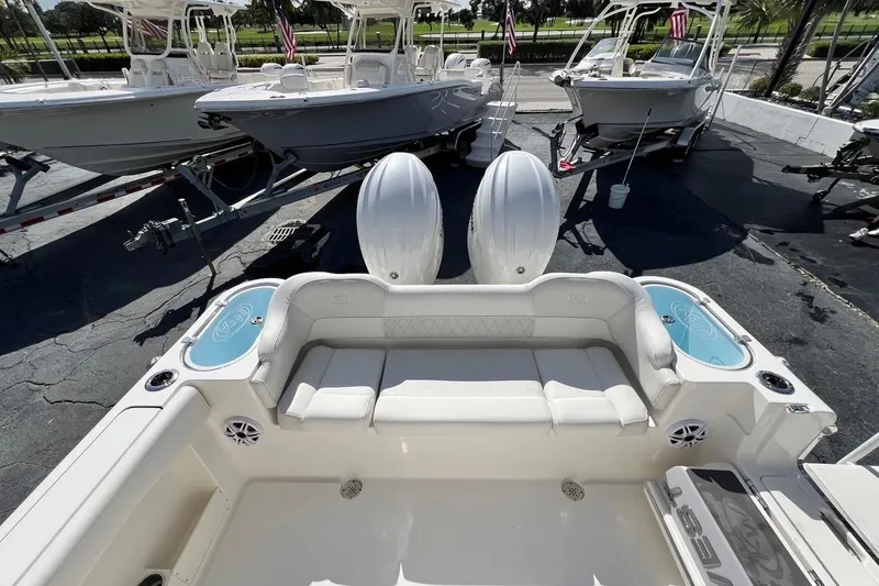 Slide: The Image of 2026 Key West 263 FS boat interior with seating and twin engines. - 17