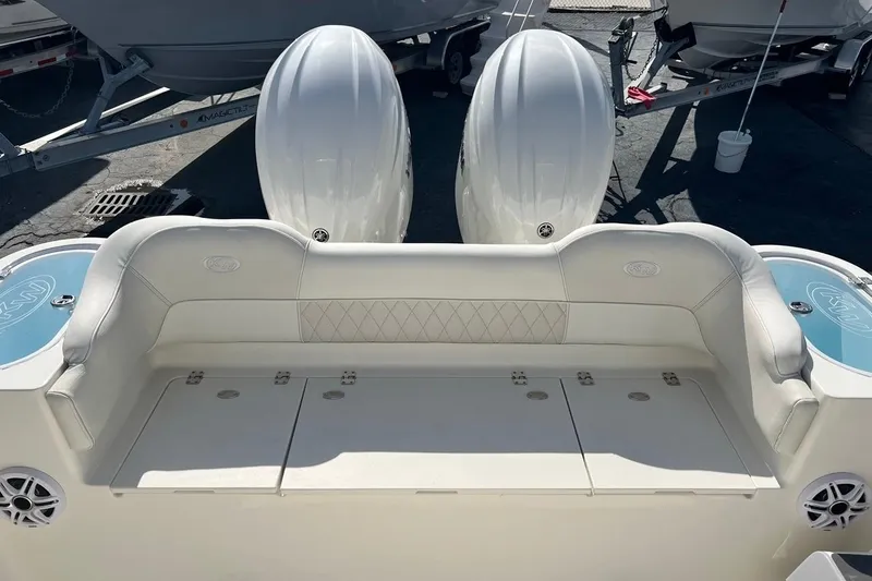Slide: The Image of 2026 Key West 263 FS boat with dual engines and cushioned seating. - 18