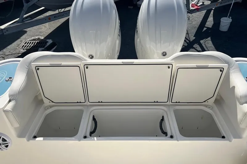 Slide: The Image of 2026 Key West 263 FS boat storage compartments and seating area. - 19