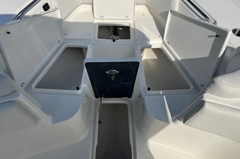 Slide: The Image of 2026 Key West 263 FS boat interior with open storage compartments. - 26