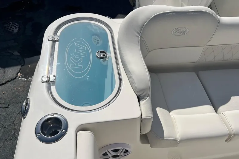 Slide: The Image of 2026 Key West 263 FS boat interior with cushioned seating and livewell. - 29