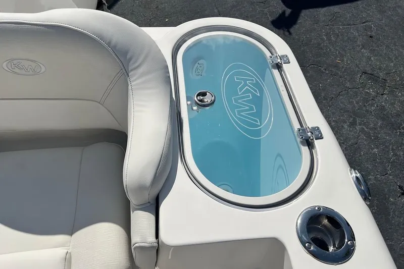 Slide: The Image of 2026 Key West 263 FS boat interior with cushioned seating and transparent compartment. - 30